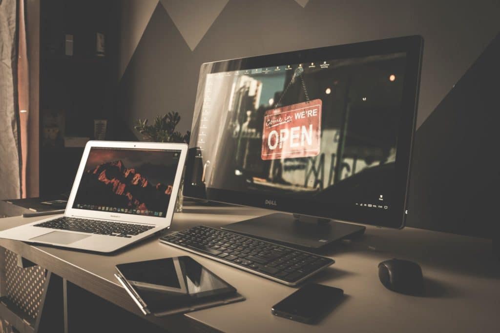 A variety of tech devices on a desk.