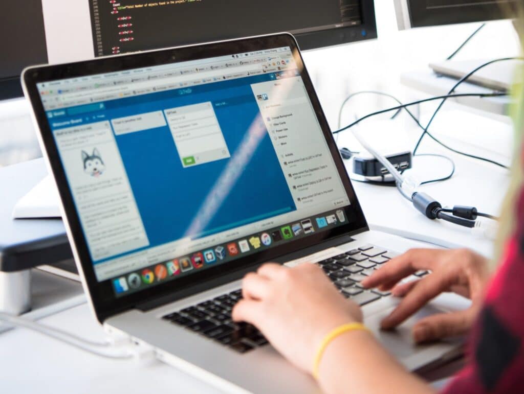 Programer comparing managed IT service prices at her desk