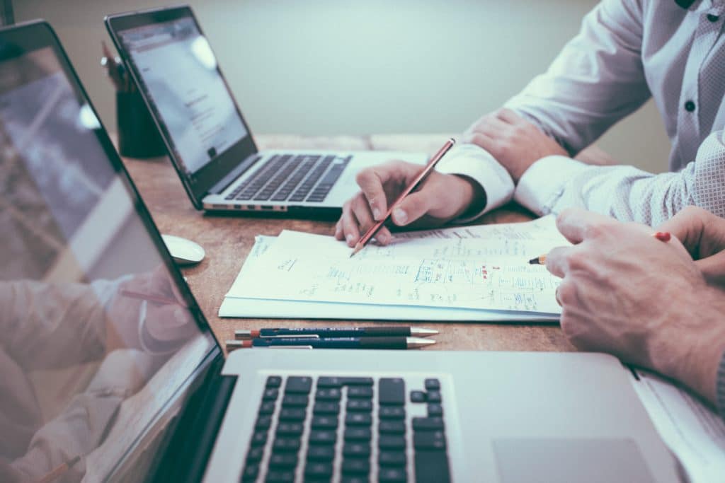 Employees going through an IT security risk assessment checklist